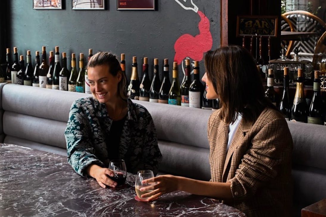 Two women enjoying a wine at Willi's bar in Perth CBD